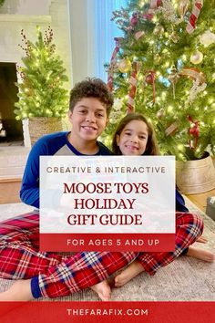 two children sitting in front of a christmas tree with the words creative and interactive moose toys holiday