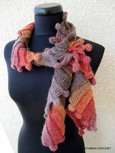 a knitted scarf on a mannequin head