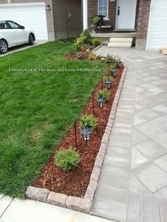 the front yard is clean and ready to be used as a flower bed or planter