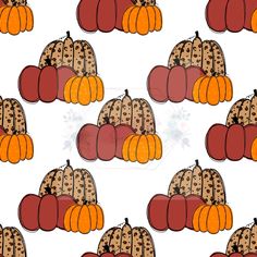 a bunch of pumpkins that are sitting on top of each other in the same pattern