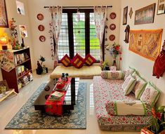 a living room filled with lots of furniture and decor