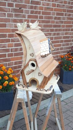 a bird house made out of wood and plywood