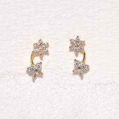 Be transported to a mystical garden in the 14k Fine Garden Party Stud Earrings. We love the dainty design and sparkly stones. Make these your go-to studs!