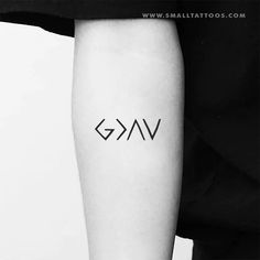 a black and white photo of a person's arm with the word g v on it