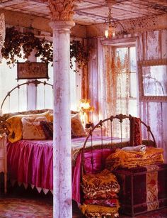 an old fashioned bedroom with pink and gold decor