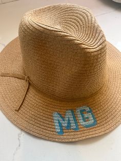 Enjoy the long summer days in style with this straw beach hat. Now you can stay safe from the sun while boating, beaching or picnicking.  It is the perfect addition to your next vacation. Add your initials to make your outfit stand out in the most memorable way.  Please message me to design the perfect gift for teacher presents, Mother's Day, or bachelorette parties. Summer Embroidered Wide Brim Hat, Summer Wide Brim Embroidered Hats, Embroidered Wide Brim Summer Hat, Beach Sun Hat With Embroidered Short Brim, Embroidered Straw Hat For Beach With Short Brim, Spring Vacation Sun Hat With Embroidery, Spring Vacation Sun Hat Embroidered, Embroidered Short Brim Straw Hat For Summer, Summer Embroidered Straw Hat With Curved Brim