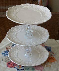 three white plates stacked on top of each other