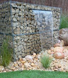 there is a rock wall in the yard