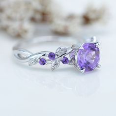 The default design option features 7mm Genuine Amethyst Center Stone and 0.2 TCW Amethyst Accents in 14K White Gold Engagement Ring. Also you can fully customize and engrave this ring by clicking the button "Personalize in 3D". Model 446-7 As well please remember it takes up to 19-21 days to make and ship this item. 3d Rings Jewellery, Purple Quince Ring, Lavender Wedding Rings, Amethyst Ring Designs, Amythest Wedding Rings, Fantasy Jewelry Ring, Wedding Rings Amethyst, Magical Engagement Rings, Engagement Rings Purple