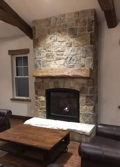 a living room filled with furniture and a fire place