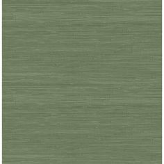 an area rug with green grasscloth