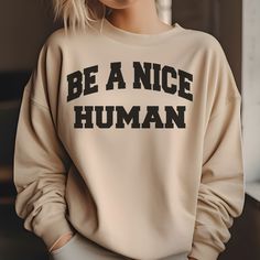 Spread positivity with our "Be A Nice Human" sweatshirt - because kindness is always in style! 💙✨ This cozy sweatshirt is more than just a piece of clothing; it's a gentle reminder to embrace compassion and make the world a better place. The empowering words "Be A Nice Human" across the chest serve as a fashionable call to action. Crafted for comfort and kindness, this sweatshirt is not just an addition to your wardrobe but a statement of your commitment to creating a positive impact. Wear it p Always Cold, Club Sweatshirts, Be A Nice Human, Professional Look, Vintage Sweaters, Cozy Sweatshirts, Original Design, Piece Of Clothing, Sweatshirt Fashion