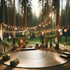 an outdoor wedding setup in the woods with string lights and greenery on the trees