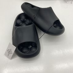 Sole Mates Black Slip On Cushion, Slides Sandals Unisex Size 7 New With Tags See Pic Bs142/24 Shoes C27 Mh4 Non-slip Black Slides With Flat Heel, Black Non-slip Sport Sandals For Summer, Black Closed Toe Sport Sandals For Beach, Black Closed Toe Slides For Summer, Black Non-slip Sandals For The Beach, Non-slip Black Flat Heel Flip Flops, Black Non-slip Flat Heel Flip Flops, Black Open Toe Sport Sandals For Beach, Black Flat Heel Slippers For Spring