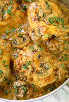 chicken with mushrooms and parsley in a pan