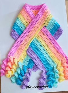 two crocheted squares are on top of each other, one is multicolored