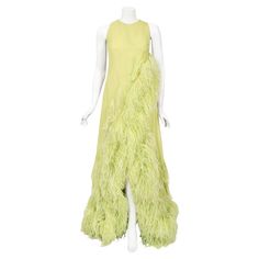 A highly coveted and truly breathtaking Christian Dior haute couture museum-quality chartreuse silk feathered glamour gown dating back to spring/summer 1968. This incredible work of wearable art was custom made for the famous actress and singer Maria Felix. We were absolutely thrilled to find a picture of her in the dress! Maria Felix was one of the most successful figures of Latin American cinema during the 1940's and 1950's. Considered one of the most beautiful actresses of Old Hollywood, her Christian Dior Wedding Dress, Glamour Gown, Ethereal Gown, Feather Gown, Robes Glamour, Haute Couture Gowns, Dior Dress, Christian Dior Haute Couture, Dior Haute Couture