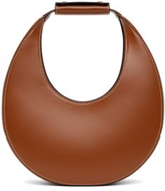 Structured buffed leather shoulder bag in tan. · Press-stud tab at integrated carry handle · Magnetic press-stud tab closure · Zip pocket at interior · Suede lining · H6.25 x W11.5 x D3.25 · Total heigh: H13.5 Supplier color: Tan Brown Bags With Round Handle For Work, Brown Bags With Round Handle For Workwear, Brown Workwear Bags With Round Handle, Staud Leather Bag, Evening Saddle Shoulder Bag In Brown, Brown Saddle Shoulder Bag For Evening, Classic Leather Shoulder Bag By Staud, Brown Shoulder Bag With Leather Lining And Round Handle, Staud Shoulder Bag With Round Handle For Everyday Use