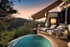 an outdoor hot tub next to a wooden deck