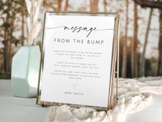 a sign that says message from the bumpp next to a vase with flowers in it