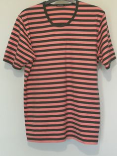 Vintage MARIMEKKO pink and black striped short sleeve Cotton top made in Finland Label size: S. Sizing can vary, to be sure that you have chosen the right size, please take a look at our measurements below. Flat measurements (approx.): shoulders: 41cm or 16'' chest: 47cm or 18.5'' length: 64 cm or 25'' sleeve: 22cm or 8.5'' Material: 100% cotton Condition: VINTAGE VERY GOOD Actual colors may vary. This is due to the fact that every monitor has a different capability to display colors and that ev Black And Pink Striped Sweater, Cheap Black T-shirt With Three Stripes, Vintage Striped Short Sleeve T-shirt, Vintage Marimekko, Pink Vertical Stripes Button-up Top, Black Horizontal Stripe Short Sleeve T-shirt, Rose Noir, Striped Short, Cotton Top