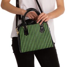 A stylish and trendy handbag featuring green and black stripes. The vibrant colors and 100% PU leather material give a sophisticated look. With a removable, adjustable shoulder strap and multiple pockets inside, this handbag is perfect for everyday use or special occasions. Ideal for fashion-forward individuals looking for a unique accessory. Product features - Vibrant colors with crisp designs - 100% PU leather material - Adjustable, removable shoulder strap - Multiple interior pockets for organization - Double-sided print for added style Care instructions - Do not dryclean - Do not expose to the sun, keep in a dry place - Before cleaning the bag, remove all the items from the bag. Suggested to pretreat visible stains with stain remover. Mix warm water with laundry detergent and clean the Striped Rectangular Bag With Adjustable Strap, Black Travel Bag With Striped Lining, Trendy Striped Bag With Adjustable Strap, Striped Rectangular Shoulder Bag With Adjustable Strap, Chic Rectangular Shoulder Bag With Striped Lining, Striped Top Handle Bag For Shopping, Modern Striped Tote Bag, Modern Green Handheld Bag, Modern Green Handheld Bags