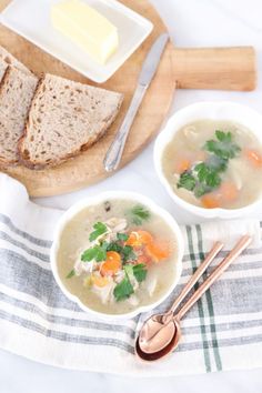 two bowls filled with chicken soup next to bread and butter on a tablecloth, text overlay reads how to make chicken soup from scratch