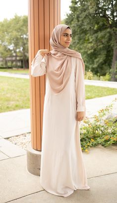 Capture a timeless, graceful silhouette with this Abaya and Duster Set, crafted from a luxuriously soft crème-colored fabric for a look of timeless elegance. Subtle pleats and side slits adorn these beautiful pieces, creating a sophisticated and feminine silhouette. Enjoy the perfect combination of comfort and style with this sophisticated set. The perfect set for those that love to match their outfits perfectly. Pair with our Olive or Creme chiffon hijab and you have a quick and classy outfit. Modest Activewear, Modest Apparel, Chiffon Hijab, Modest Swimwear, Colored Fabric, Feminine Silhouette, Other Outfits, Maxi Skirts, Muslim Women