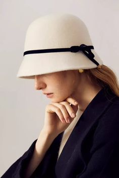 Elegant Vintage Wool with Chic Bow Embrace timeless fashion with our French-Inspired Wool Cloche Hat. Crafted from luxurious 100% high-quality merino wool, this hat combines exceptional warmth and breathability. Its natural luster adds a sophisticated charm, perfect for elevating any outfit. Inspired by Audrey Hepburn's classic style, this cloche hat is not just a headwear but a fashion statement, blending seamlessly with both contemporary and vintage aesthetics. Style #: WWAI5A3 Luxury Beige Elegant Cloche Hat, Luxury Beige Cloche Hat, Elegant Fur Felt Hat For Winter, Elegant Wool Cloche Hat For Fall, Winter Wool Cloche Felt Hat, Chic Wool Cloche Hat For Winter, Fitted Cloche Winter Hat, Chic Wool Felt Hat With Flat Brim, Elegant Wool Fedora For Winter