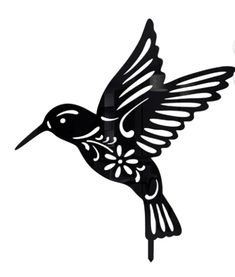 a black and white bird is flying in the air