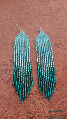 These handmade earrings are made of high-quality Czech beads and strong synthetic thread. They are elegant, fashionable, and highly versatile, suitable for everyday wear. Color: turquoise, emerald, teal . 100% hand made with love! Measurements: Length-about 11.5cm (4.33 inch) Width -about 2 cm (0.79 inch) Materials: Sterling silver components Czech glass beads Nylon Thread Green Fringed Beach Jewelry, Turquoise Beaded Long Drop Earrings, Beaded Fringe Dangle Jewelry For Beach, Green Fringe Dangle Jewelry, Beach Dangle Jewelry With Beaded Fringe, Green Beaded Fringe Jewelry For Summer, Green Beaded Long Drop Jewelry, Chandelier Boho, Unique Handmade Earrings