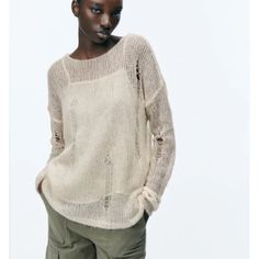 Add A Touch Of Elegance To Your Wardrobe With This Zara Sweater. Made Of A Blend Of Wool And Alpaca, This Knit Sweater Is Both Soft And Durable. The Ivory Color And Solid Pattern Make It A Versatile Piece That Can Be Dressed Up Or Down. Featuring A Round Neckline And Long Sleeves, This Pullover Sweater Is Perfect For Any Occasion. The S Size Is Designed For Regular Fit, And The Fabric Type Is Knit. With Its Unique Design And High Quality, This Zara Sweater Is A Must-Have For Any Fashion-Forward Casual Open Knit Sweater For Layering, Beige Pointelle Knit Sweater For Spring, Fine Knit Long Sleeve Sweater In Neutral Color, Fall Open Knit Long Sleeve Tops, Fall Long Sleeve Open Knit Top, Casual Open Knit Top For Fall, Long Sleeve Open Knit Top For Layering, Beige Open Knit Crew Neck Top, Beige Textured Knit Sweater For Spring