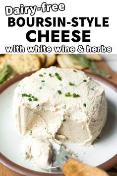 dairy - free boursin - style cheese with white wine and herbs on a plate