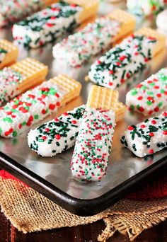 christmas crackers and waffles on a baking sheet with sprinkles