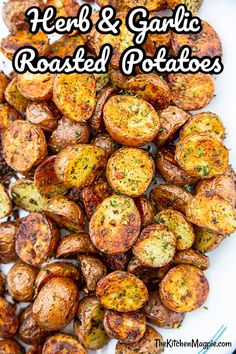 roasted potatoes on a white plate with seasoning sprinkled around the top and side