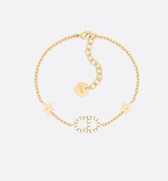 The Clair D Lune bracelet set is both delicate and elegant. The two gold-finish metal chain bracelets showcase some of Dior's classic symbols and sparkling crystals. The bracelet set may be worn with other Clair D Lune creations.. Designer Gold Metal Chain Bracelet, Designer Gold Chain Bracelet, Designer Gold Bracelets With Logo Charm, Luxury Gold-tone Bracelet With Logo Charm, Luxury Gold Jewelry With Logo Charm, Yellow Gold Metal Chain Bracelet With Logo Charm, Gold Diamond Bracelet With Adjustable Chain, Gold-tone Bracelet With Logo Charm, Designer Gold-tone Chain Bracelets