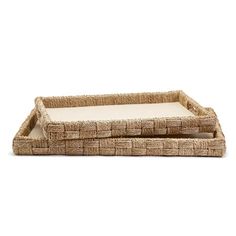 two rectangular wicker trays with white cushions on each side, one in the shape of a rectangle