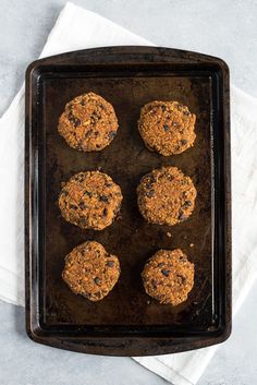 six cookies on a baking tray ready to be baked