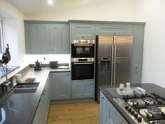 a kitchen with an oven, stove and refrigerator