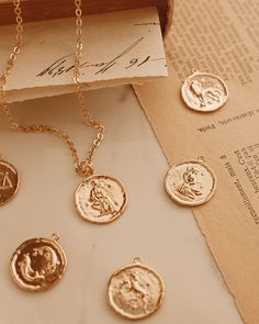 The Gold Zodiac necklace is the true statement of identity, and symbolizes pride in oneself. Choose from the twelve zodiac star signs! Styles beautifully, layered with a longer or shorter pendant. All Zodiac Coins are 14K Gold Plated Brass. Gold plated chain (18mm), length: 17 inches (19 inches with extender). Pictured: Aquarius Coin. Aquarius: January 20 to Feb 18 Pisces: Feb19 to March 20Aries: March 21-April 19 Taurus: April 20-May 20 Gemini: May 21-June 20 Cancer: June 21-July 22 Leo: July 2 Dreamy Collage, Academia Wardrobe, Neutrals Aesthetic, Notion Setup, Aesthetic Android, Necklace Stacking, Aquarius Aesthetic, Necklaces Gift, Neutral Aesthetic