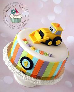 a birthday cake with a toy truck on top