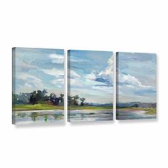 three pieces of art with water and clouds in the background, on a white wall