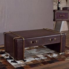 a brown suitcase sitting on top of a checkered floor in front of a mirror