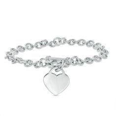 Simple, meaningful and so stylish, this darling heart charm bracelet is certain to win hers. Fashioned in sleek sterling silver, this rolo chain bracelet is finished with a lovely heart-shaped dangle charm. A look she'll treasure, this 7.25-inch bracelet is polished to a brilliant shine and secures with a toggle clasp. Elegant Everyday Sterling Silver Bracelet With Heart Charm, Elegant Sterling Silver Bracelet With Heart Charm For Everyday, Elegant Hypoallergenic Heart-shaped Charm Bracelet, Elegant Hypoallergenic Heart Charm Bracelet, Elegant Everyday Heart-shaped Sterling Silver Bracelet, Elegant Everyday Sterling Silver Heart Bracelet, Elegant Everyday Heart Bracelet With Charms, Dainty Sterling Silver Charm Bracelet With Heart Charm, Classic Silver Heart Bracelet