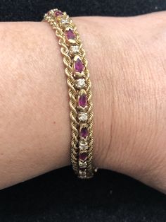 This is an elegant 14K gold ruby and diamond bracelet. The solid rope gold frames the alternating marquis rubies and diamonds over the entire bracelet. The bracelet, circa 1970s, weighs 18.18 grams and is 7 inches long. The bracelet is stamped 14K. Luxury Victorian Gold Bracelet For Anniversary, Rich Wishlist, Braclets Gold, Ruby Bracelets, Vintage Gold Bracelet, Rubies And Diamonds, Dope Jewelry Accessories, Diesel Watch, Wedding Bracelets