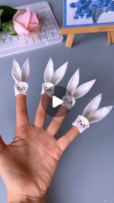 the fingers are decorated with fake white flowers