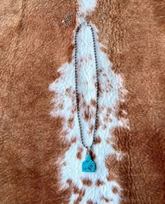 Cattle Tag Semi Stone Navajo Necklace -Semi Stone Comes In Different Size, Color& Shape -Measures 16" + 3" -Pendant Measures 2.5 cm X 2 cm -Nickel and Lead Compliant -Faux Navajo Pearl(Plastic Beads) What are Semi Stone? : Semi-precious stones are gemstones made of minerals and other organic matter. They are aplenty and found in a great many shades and unique colors. No Returns Southwestern Style Adjustable Teardrop Necklace, Adjustable Southwestern Turquoise Pendant Necklace, Southwestern Blue Concho Necklace, Southwestern Style Blue Concho Necklace, Bohemian Stamped Turquoise Necklace, Southwestern Arrowhead Jewelry Gift, Concho Sterling Silver Necklace For Gifts, Southwestern Style Arrowhead Jewelry Gift, Turquoise Concho Necklace As Gift