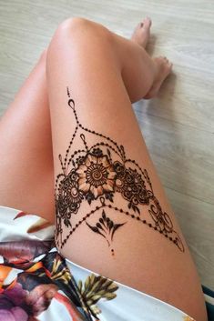 a woman's legs with hennap on it and the bottom half of her leg