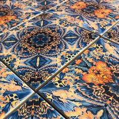 an artistic tile design with orange and blue colors