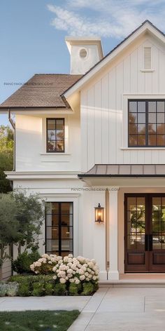 a large white house with two story windows